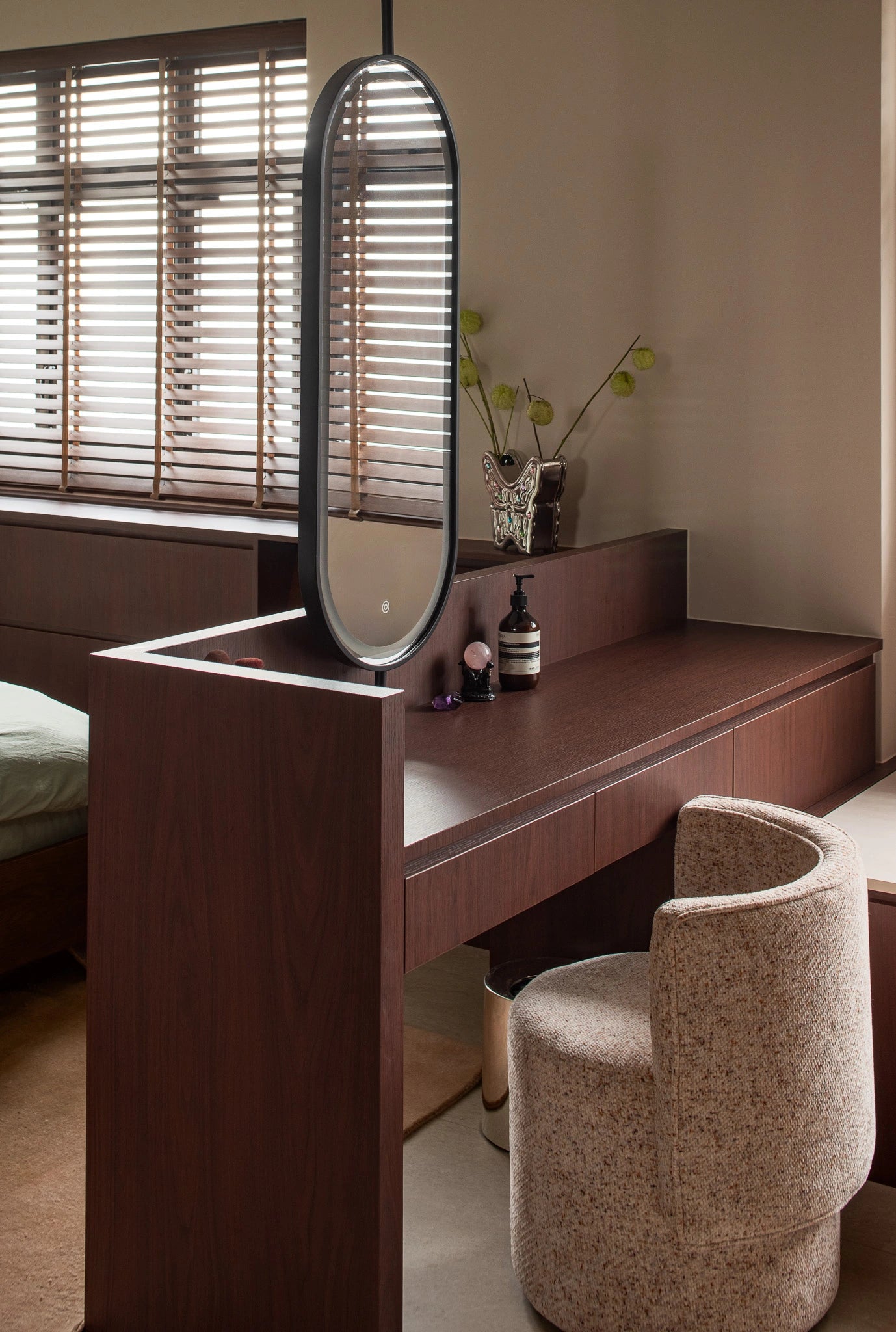 Mid-century modern bedroom with built-in dresser and round accent chair