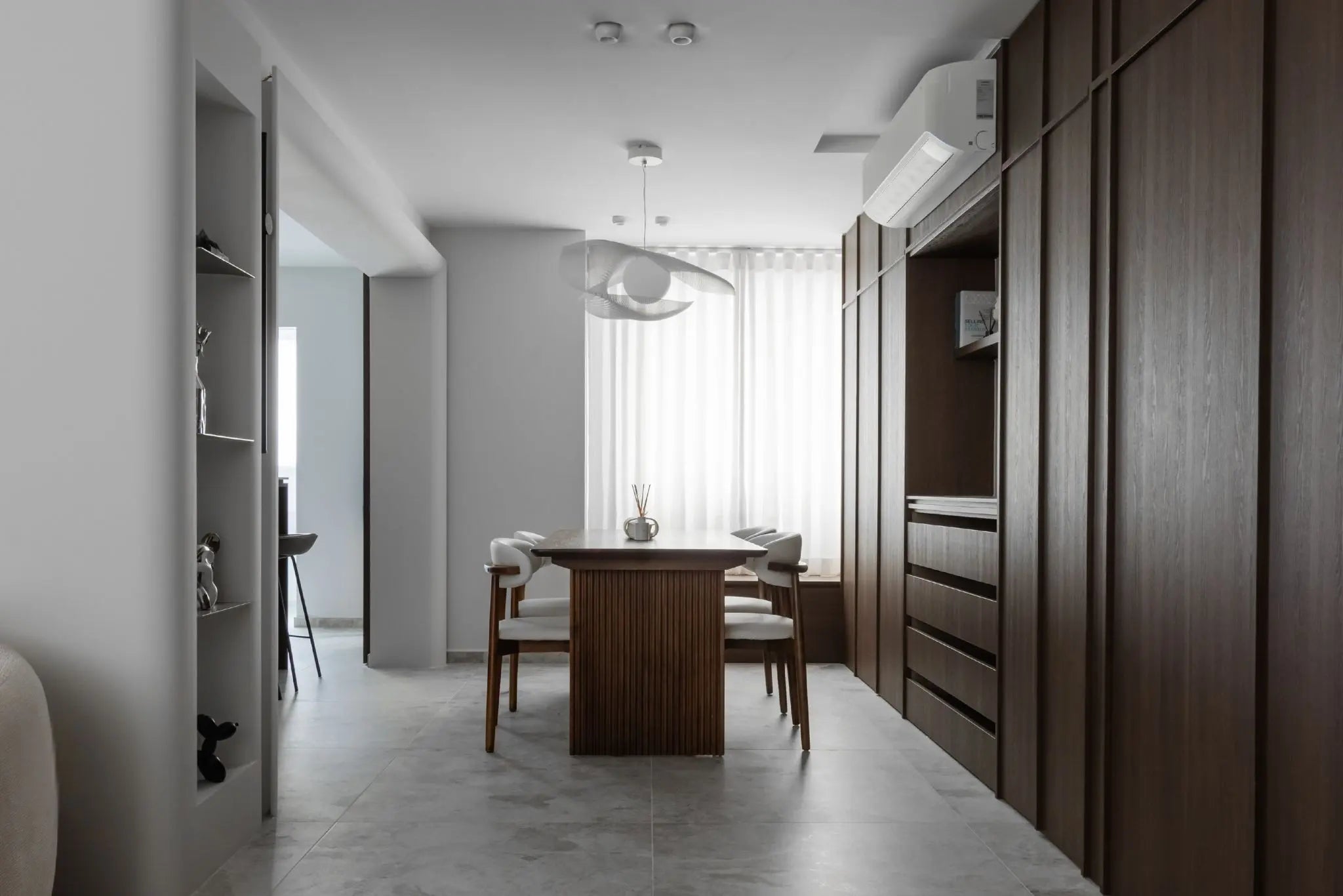 Mid-century modern dining room with walnut wood furniture and pendant light