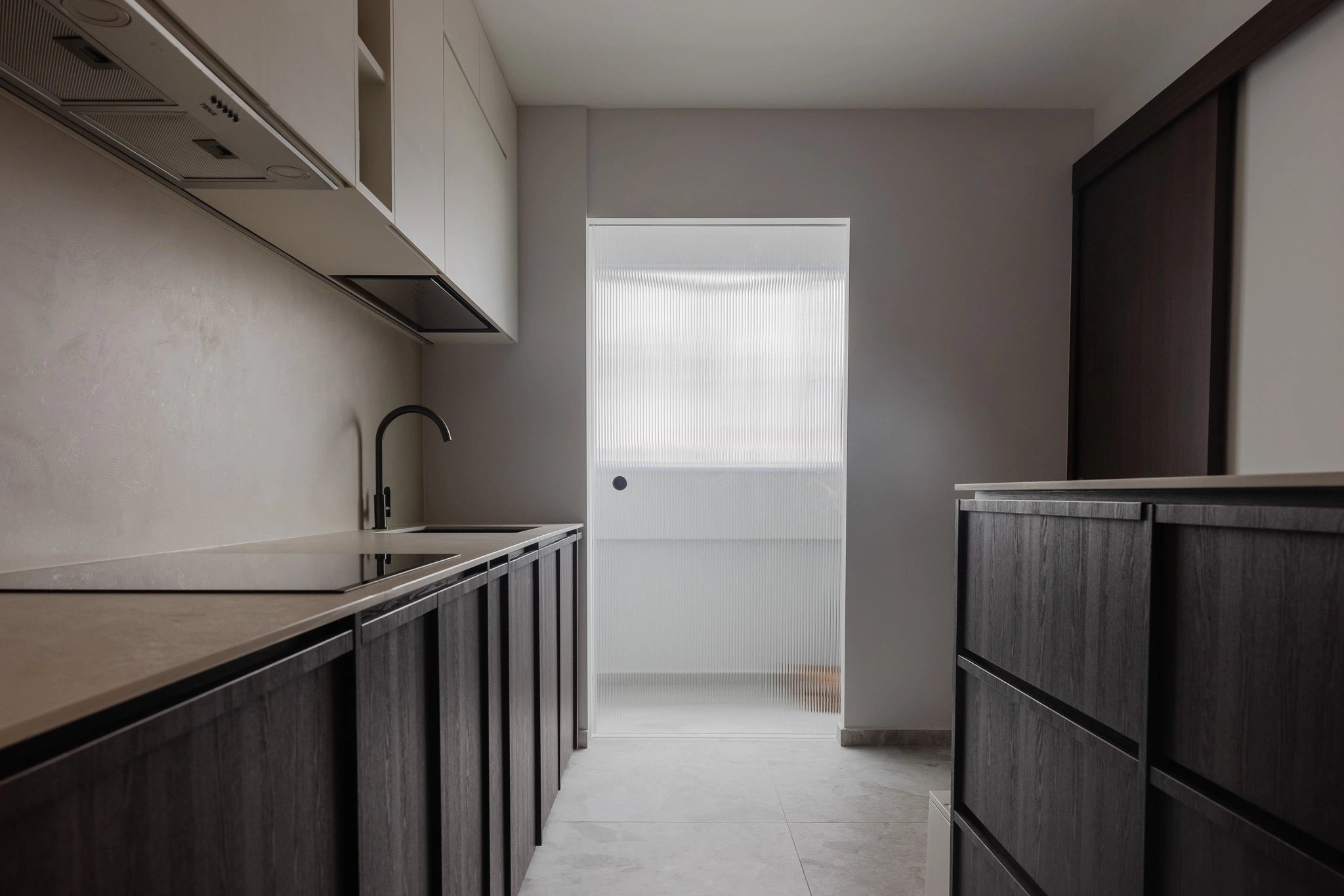 Mid-century modern kitchen with stone countertop and custom cabinetry
