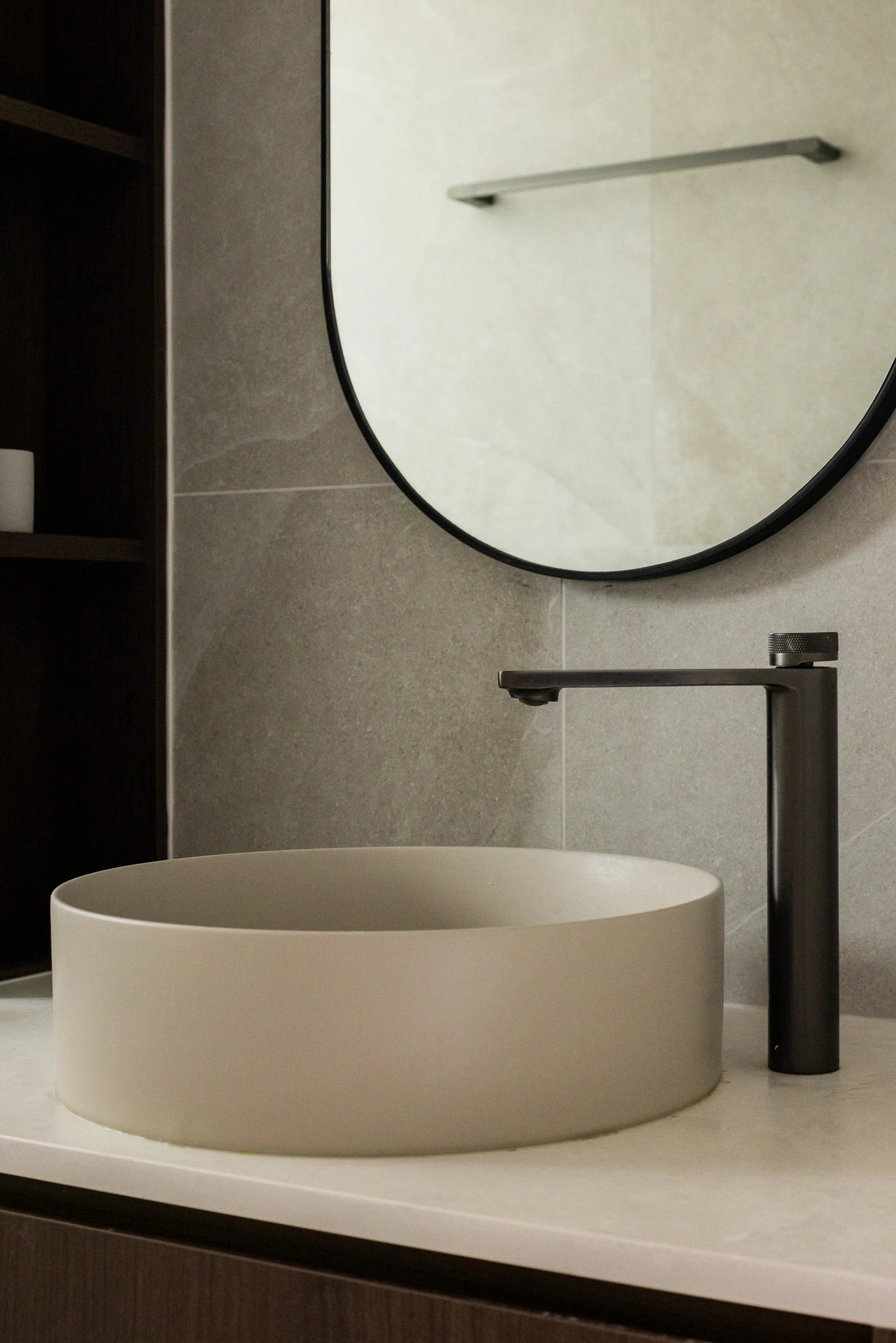 Mid-century modern bathroom with countertop basin and gunmetal faucet